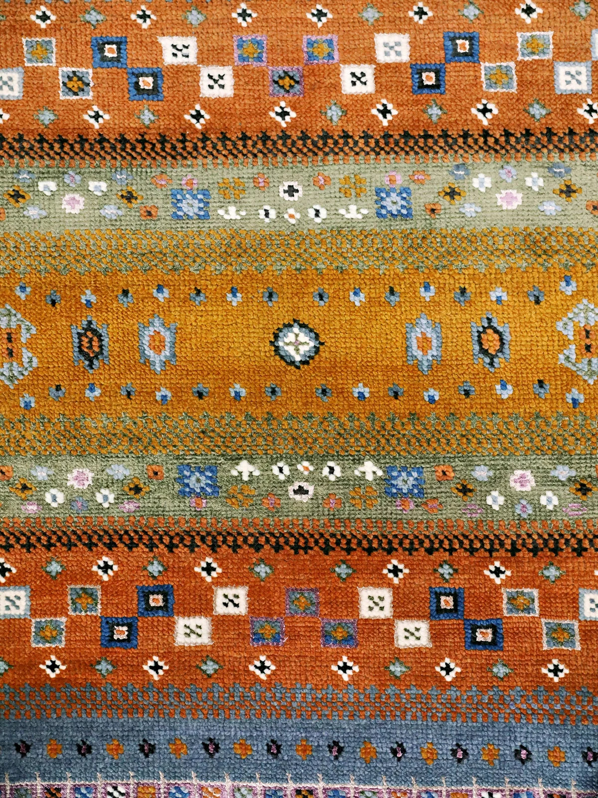Intricate patterns of Dusk Symphony Cream and Orange Oushak Rug